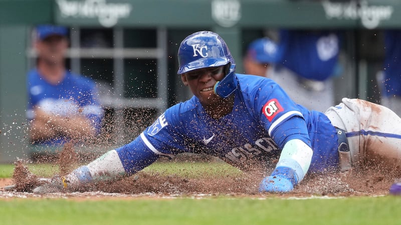 Kansas City Royals' Dairon Blanco scores after a single by Vinnie Pasquantino during the third...