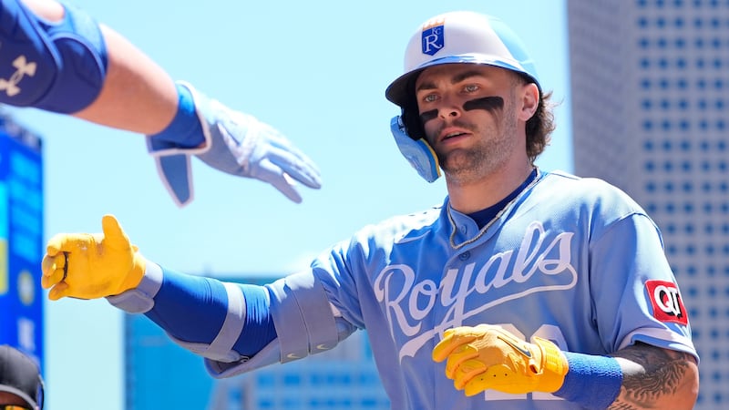 Kansas City Royals' Carter Jensen celebrates his solo home run against the Minnesota Twins in...