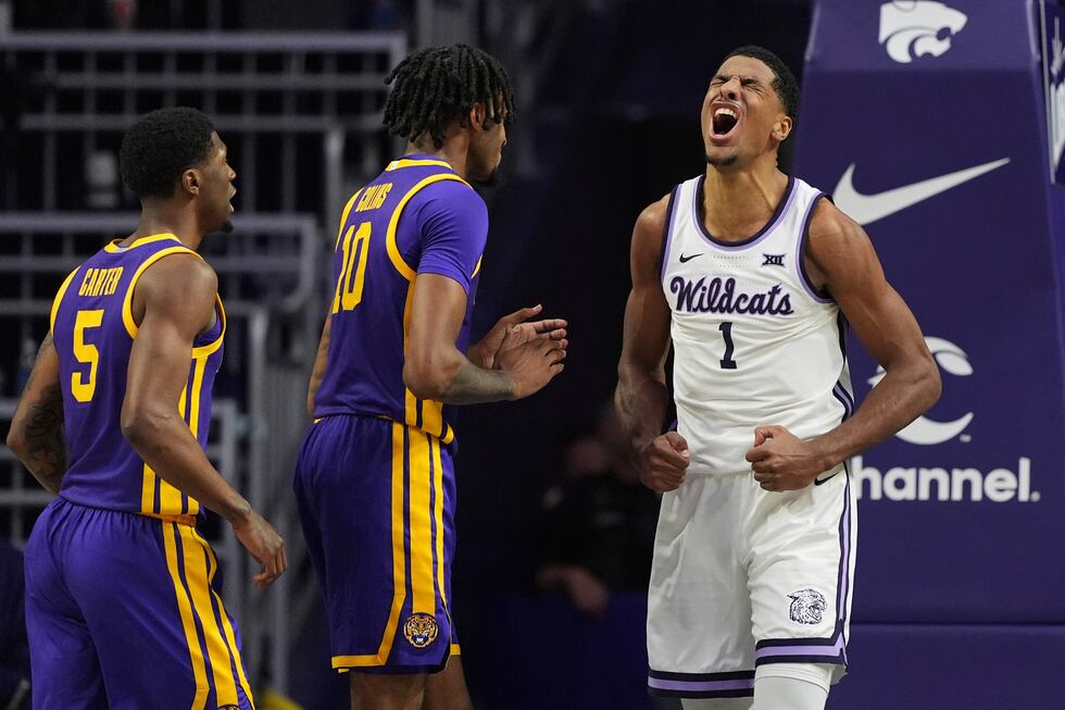 Kansas State guard David N'Guessan (1) celebrates after making a basket during the first half...