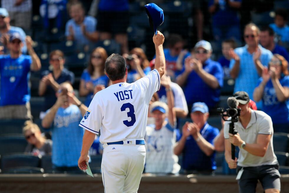 Kansas City Royals manager Ned Yost (3) tips his hat to the crowd before a baseball game...
