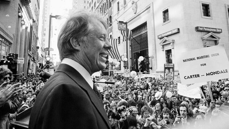 FILE - An estimated crowd of 35,000 people gather for a noontime speech by Presidential...