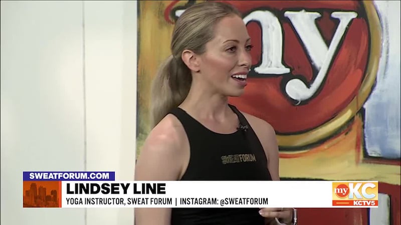 Lindsey Line with Sweat Forum teaches Shane and Kerrigan some yoga moves, while describing the...