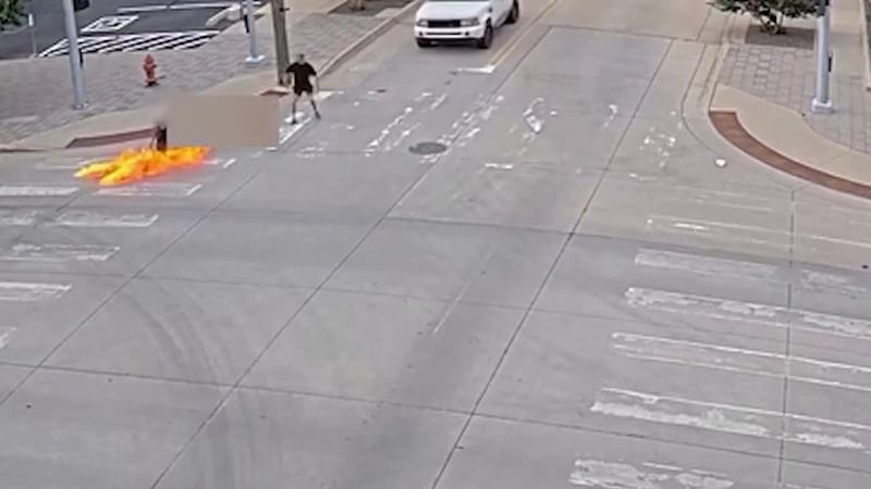 A man is accused of throwing a Molotov cocktail at a man in a wheelchair.