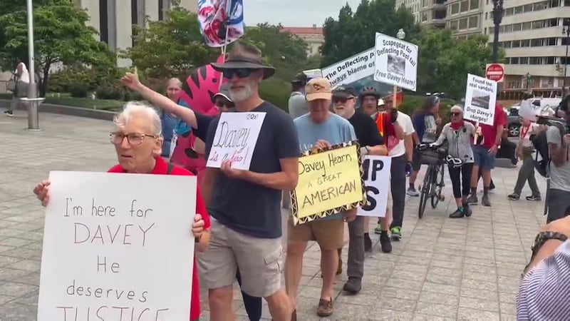 Supporters of David Hearn at courthouse as the former Olympian faces charges for allegedly...